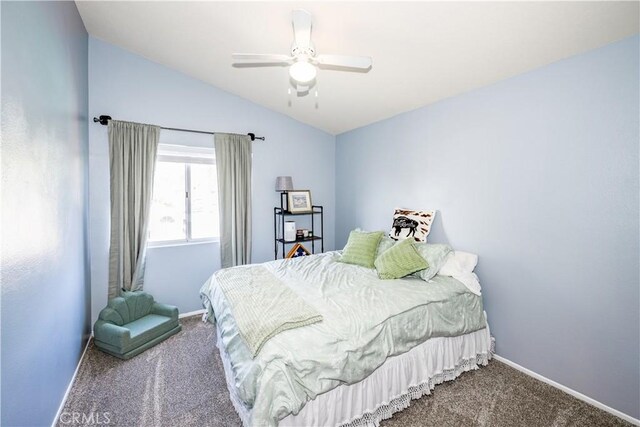 bedroom with carpet floors, baseboards, vaulted ceiling, and ceiling fan