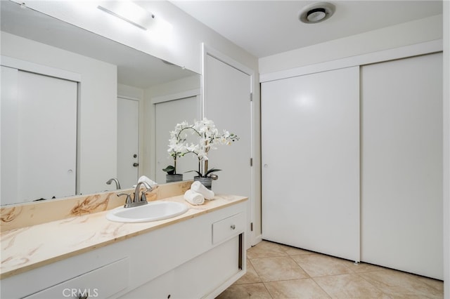 bathroom with vanity and tile patterned floors
