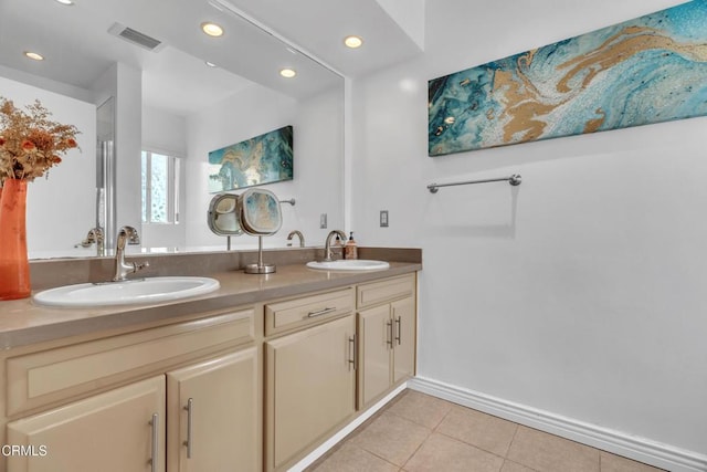 full bath featuring tile patterned flooring, a sink, double vanity, and recessed lighting