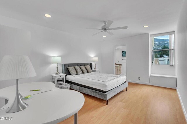 bedroom featuring recessed lighting, baseboards, and light wood-type flooring