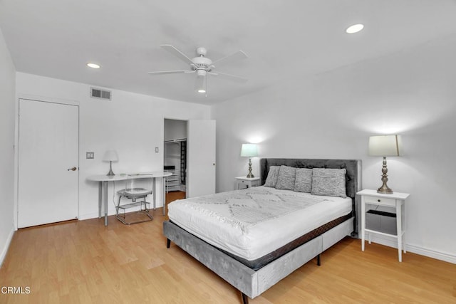 bedroom featuring visible vents, recessed lighting, light wood-style floors, and baseboards
