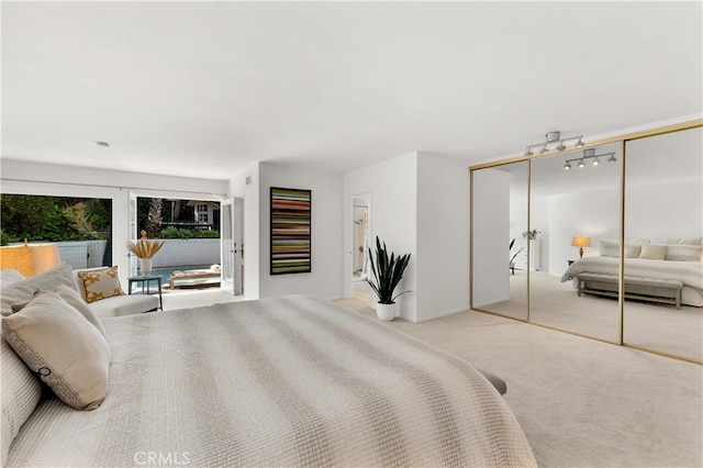 bedroom with carpet floors and baseboards