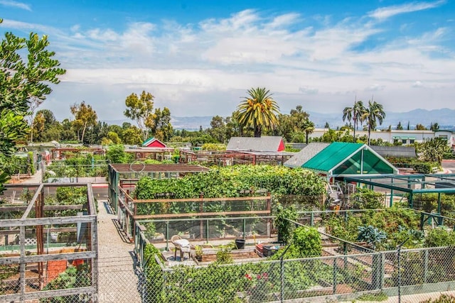 view of community featuring a garden