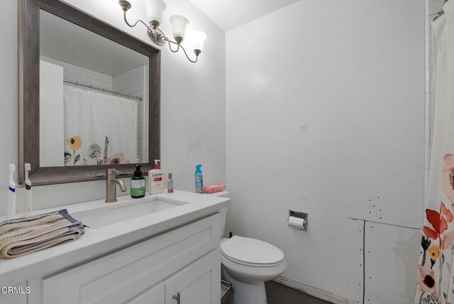 bathroom with toilet and vanity