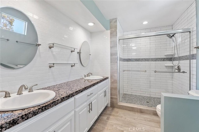 23341 Bessemer St, Woodland Hills, CA 91367 - full bathroom featuring a sink, toilet, and a shower stall