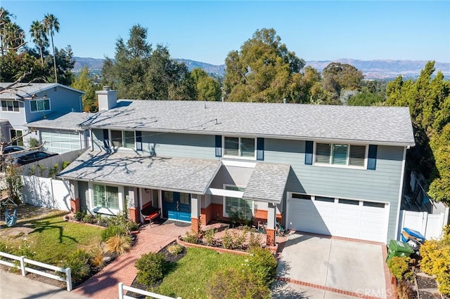 23341 Bessemer St, Woodland Hills, CA 91367 - view of front of house with covered porch, a front yard, fence, concrete driveway, and an attached garage