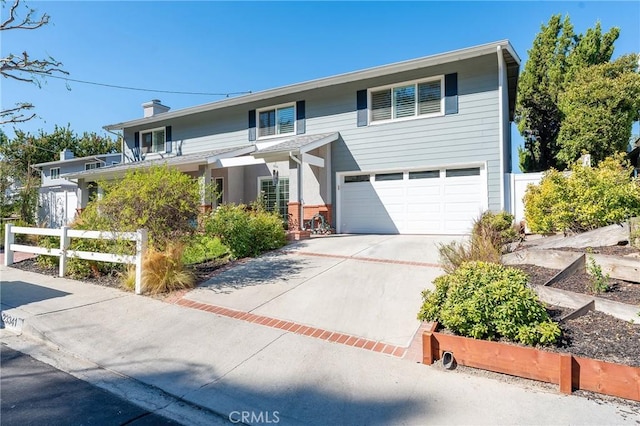 23341 Bessemer St, Woodland Hills, CA 91367 - view of front of property featuring fence, a chimney, driveway, and a garage