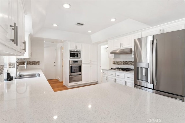 23341 Bessemer St, Woodland Hills, CA 91367 - kitchen featuring a sink, stainless steel appliances, under cabinet range hood, visible vents, and a warming drawer