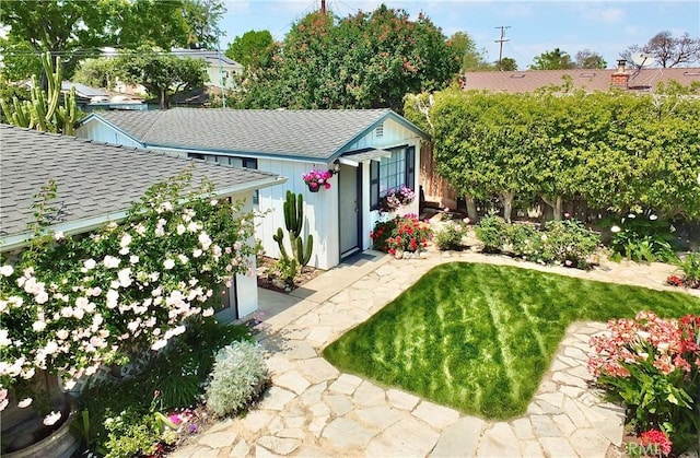 exterior space with an outdoor structure and a fenced backyard