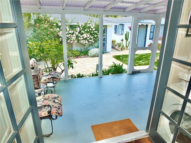 sunroom / solarium with beamed ceiling
