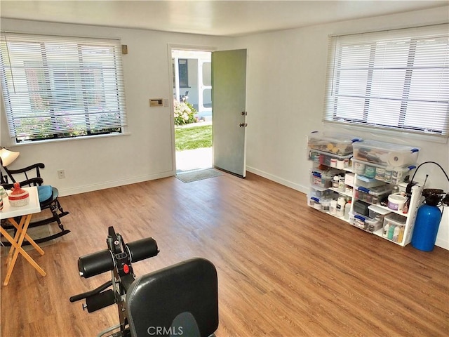 3835 California Ave, Long Beach, CA 90807 - exercise room with healthy amount of natural light, wood finished floors, and baseboards