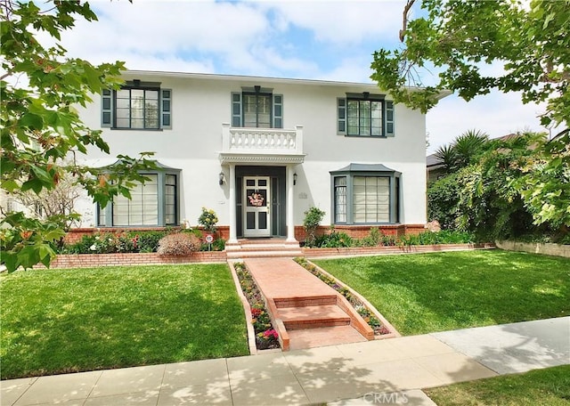 3835 California Ave, Long Beach, CA 90807 - view of front facade with stucco siding, a front yard, and brick siding
