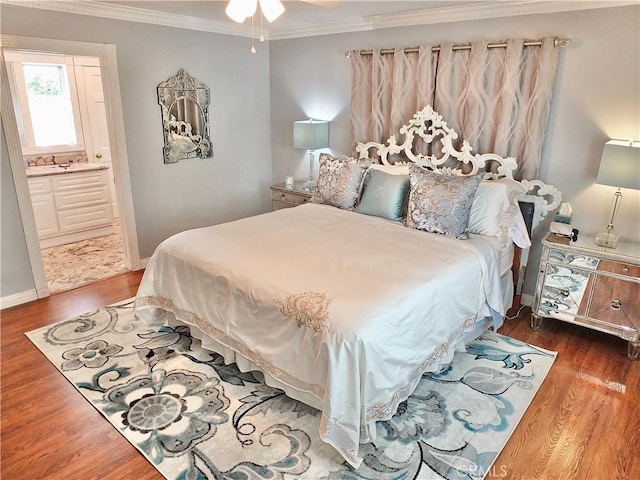 3835 California Ave, Long Beach, CA 90807 - bedroom with ornamental molding, wood finished floors, baseboards, and connected bathroom
