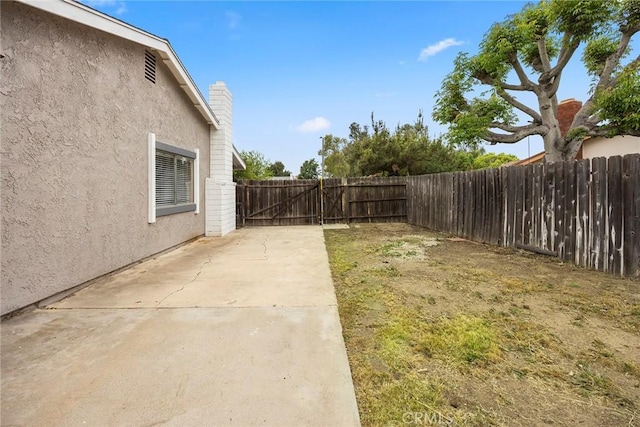 3881 Valle Vista Dr, Chino Hills, CA 91709 - fenced backyard with a patio area and a gate