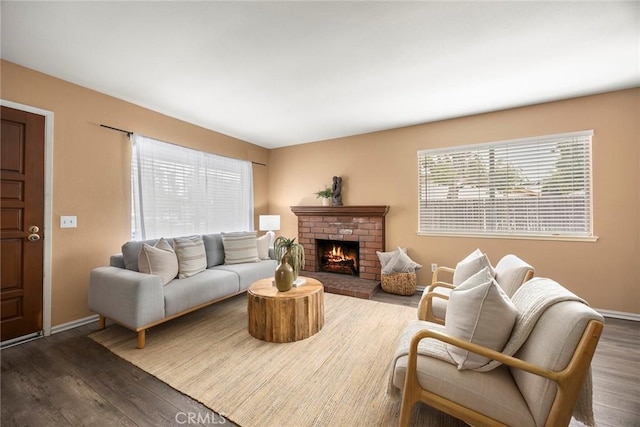 3881 Valle Vista Dr, Chino Hills, CA 91709 - living room with dark wood-type flooring, baseboards, and a brick fireplace
