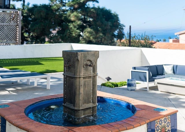details featuring a fenced backyard and an outdoor fire pit