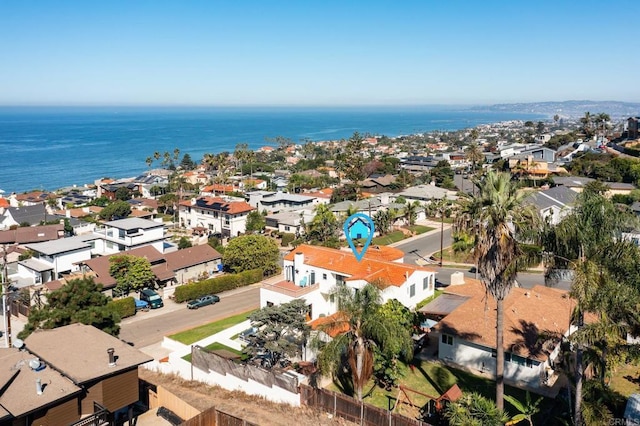 bird's eye view featuring a water view and a residential view