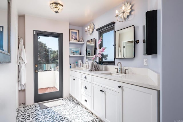 bathroom with a sink and double vanity