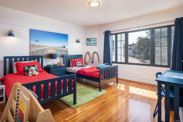 bedroom featuring wood finished floors