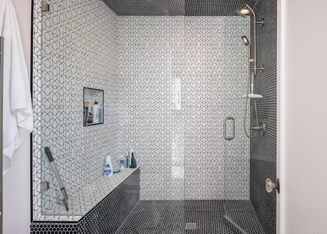 full bath with a shower stall