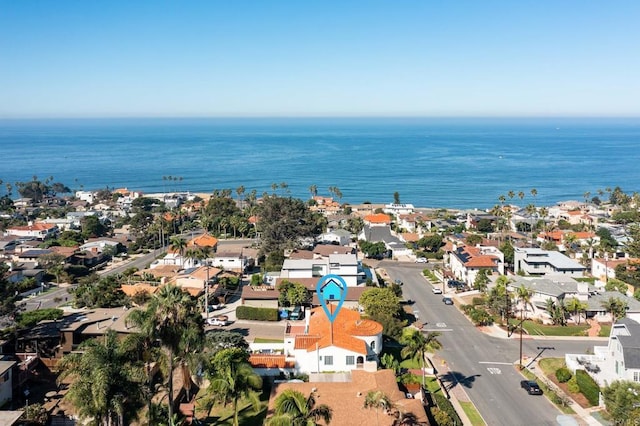 drone / aerial view featuring a water view and a residential view