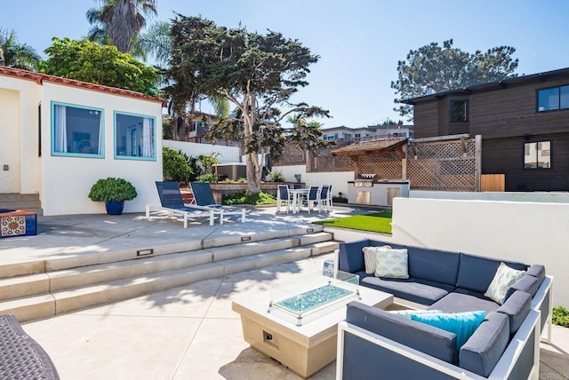 view of patio featuring outdoor lounge area, exterior kitchen, and outdoor dining space