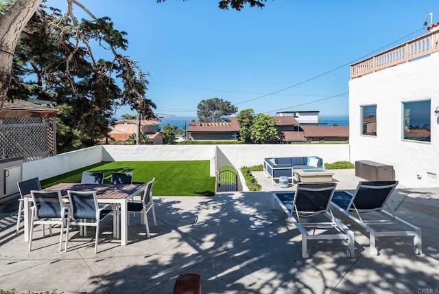 view of patio with a fenced backyard, outdoor dining space, and outdoor lounge area