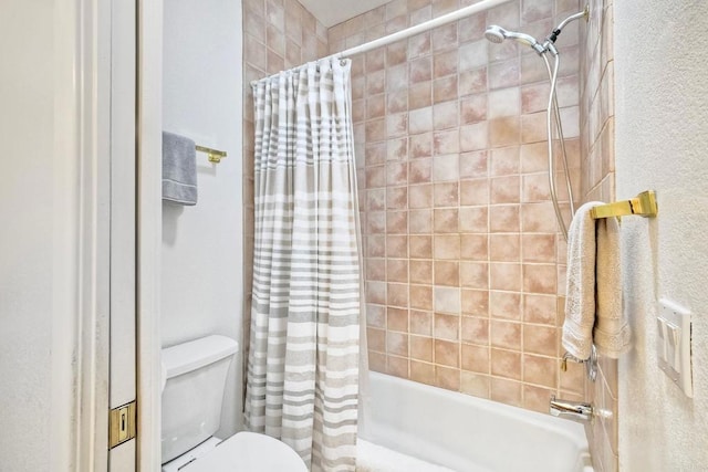 bathroom with shower / bath combo and toilet