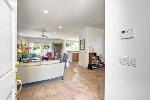 living room featuring recessed lighting, a ceiling fan, and light tile patterned flooring