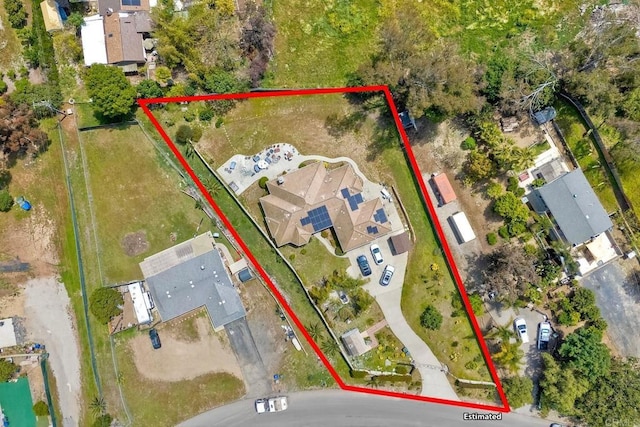 birds eye view of property with a residential view