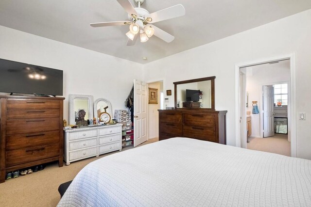 bedroom featuring a ceiling fan and light carpet