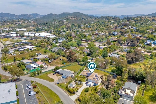 birds eye view of property with a residential view and a mountain view