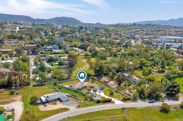 birds eye view of property featuring a mountain view
