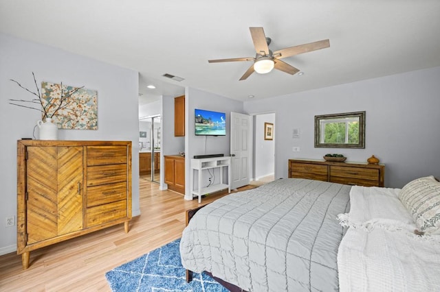 1752 Cottonwood Dr, Vista, CA 92081 - bedroom featuring light wood-style floors, baseboards, ceiling fan, and connected bathroom