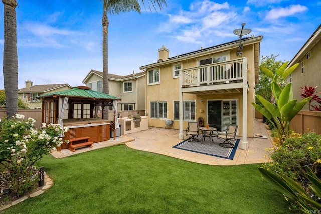 1752 Cottonwood Dr, Vista, CA 92081 - rear view of property with a hot tub, a balcony, stucco siding, a patio, and a chimney