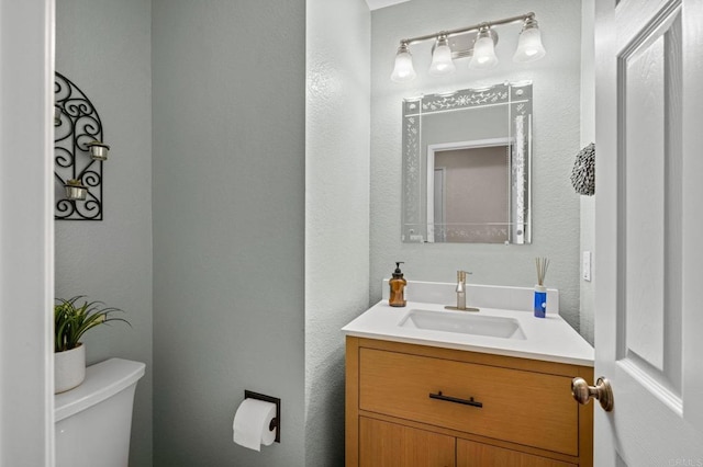 1752 Cottonwood Dr, Vista, CA 92081 - half bathroom featuring vanity and toilet
