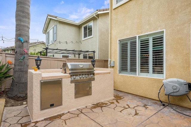 1752 Cottonwood Dr, Vista, CA 92081 - view of patio / terrace featuring exterior kitchen, area for grilling, and fence