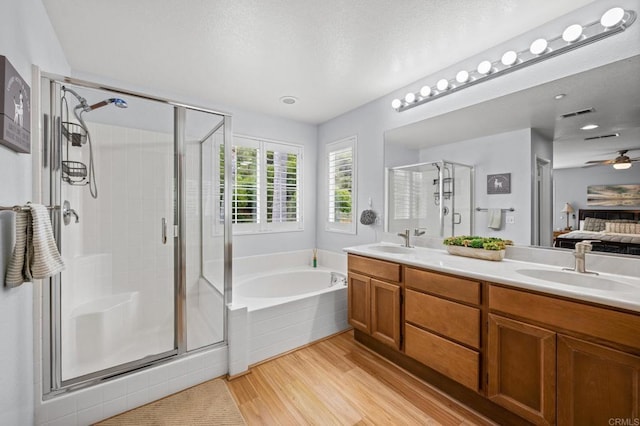 1752 Cottonwood Dr, Vista, CA 92081 - full bathroom featuring wood finished floors, ensuite bath, a stall shower, a garden tub, and double vanity