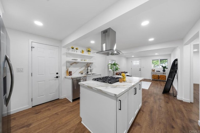 kitchen with white cabinets, a center island, stainless steel appliances, island exhaust hood, and dark wood-type flooring