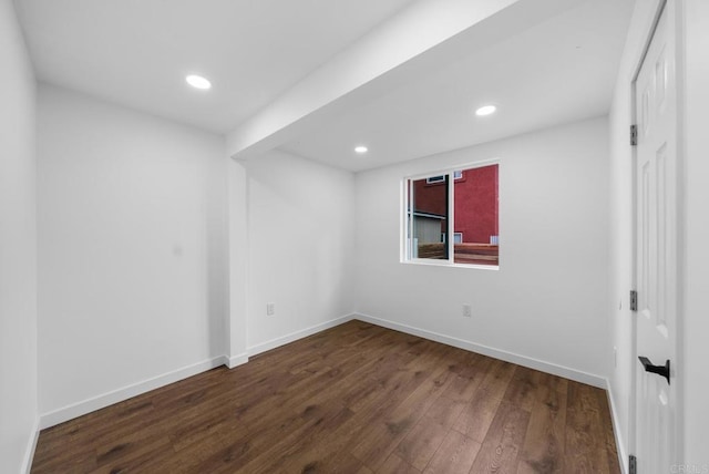 unfurnished room featuring recessed lighting, baseboards, and dark wood finished floors