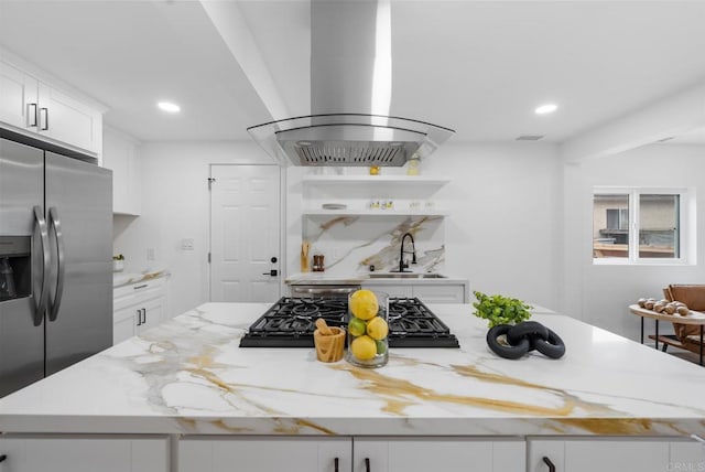 kitchen with stainless steel fridge with ice dispenser, a center island, recessed lighting, and island range hood