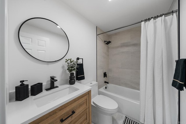 full bathroom with vanity, toilet, tile patterned floors, and shower / bath combo with shower curtain