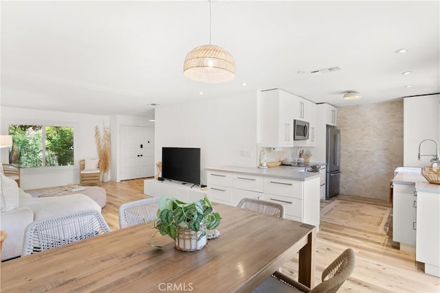 22352 Torino, Laguna Hills, CA 92653 - dining space with light wood-style floors and recessed lighting