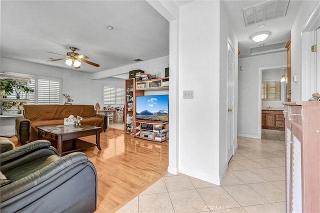 1302 S Gladys Ave, San Gabriel, CA 91776 - living room featuring ceiling fan, light tile patterned flooring, and baseboards