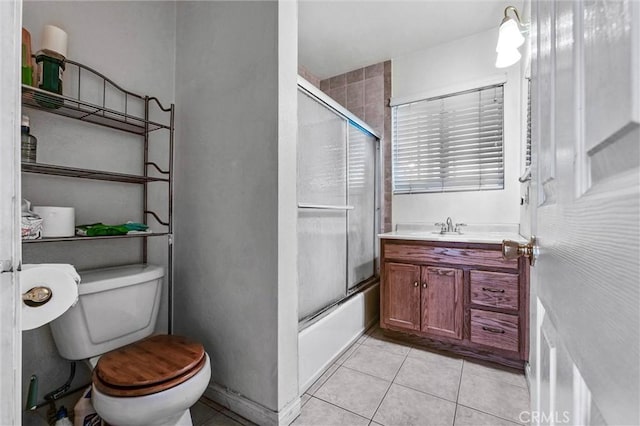 1302 S Gladys Ave, San Gabriel, CA 91776 - bathroom featuring toilet, tile patterned flooring, shower / bath combination with glass door, and vanity