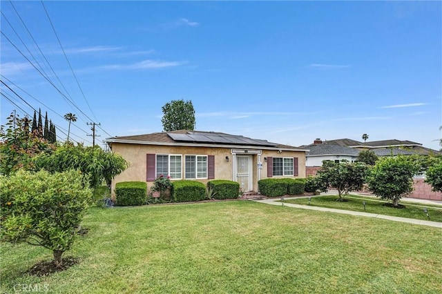 1302 S Gladys Ave, San Gabriel, CA 91776 - view of front of house with stucco siding, a front yard, and solar panels