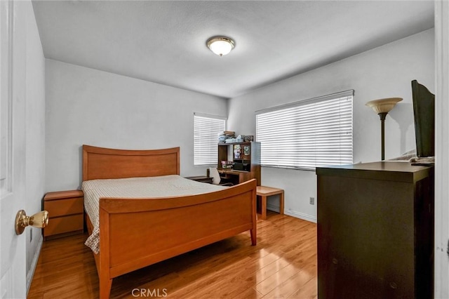 1302 S Gladys Ave, San Gabriel, CA 91776 - bedroom featuring wood finished floors and baseboards
