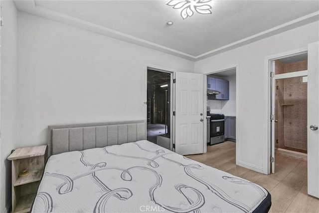 1302 S Gladys Ave, San Gabriel, CA 91776 - bedroom featuring light wood-style floors, a spacious closet, and baseboards