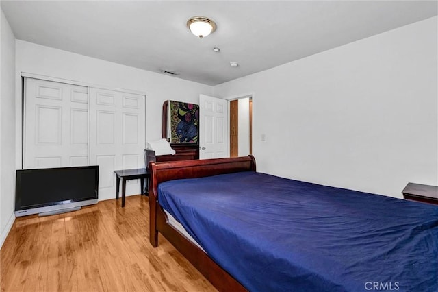 1302 S Gladys Ave, San Gabriel, CA 91776 - bedroom with light wood-type flooring and a closet