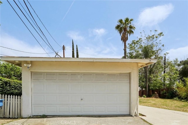 detached garage with fence